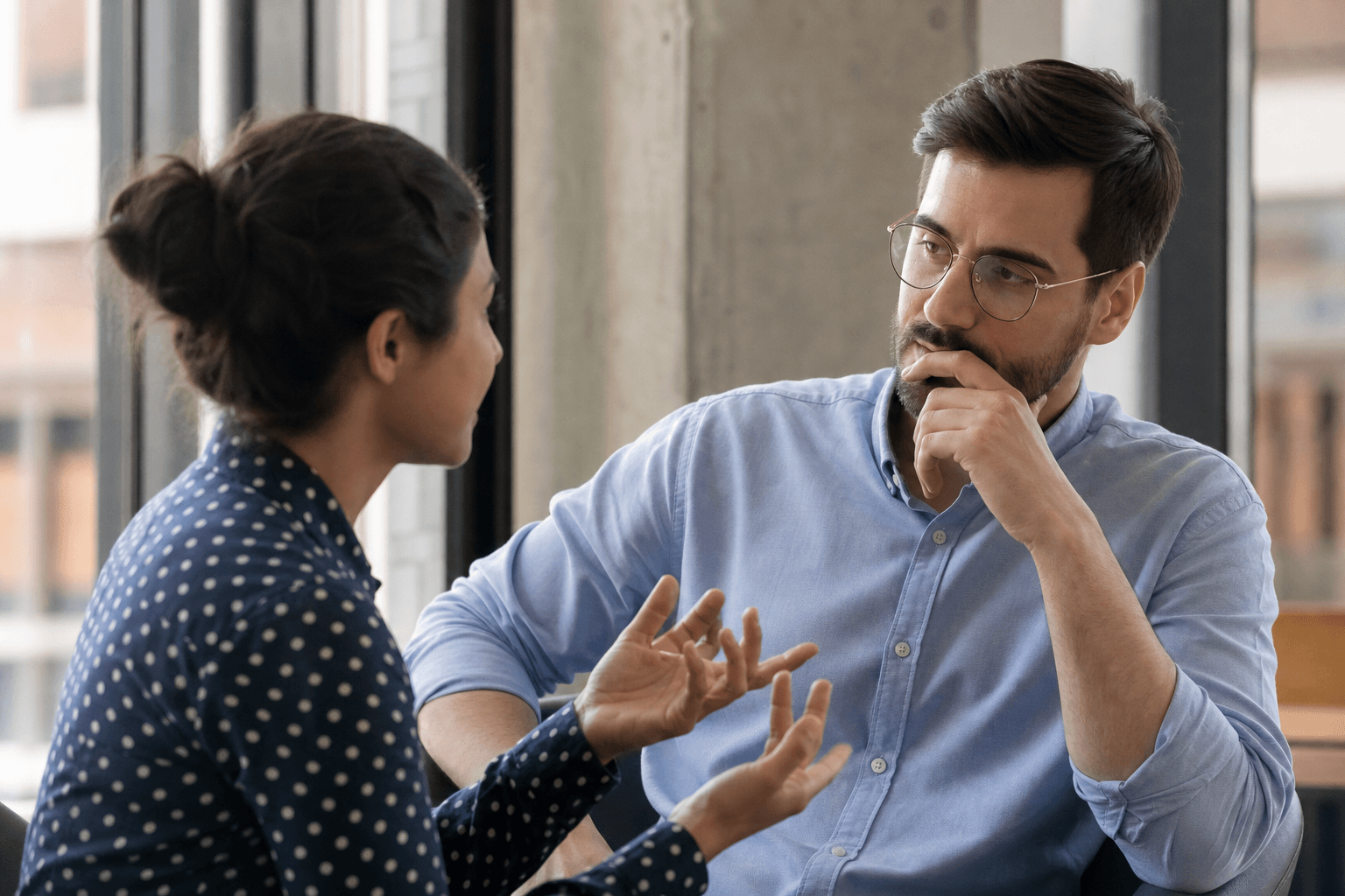 Two colleagues navigating a demanding conversation with care